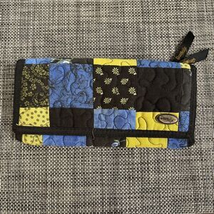 Donna Sharp quilted wallet In blue, black, and yellow patchwork pattern 8”x4”